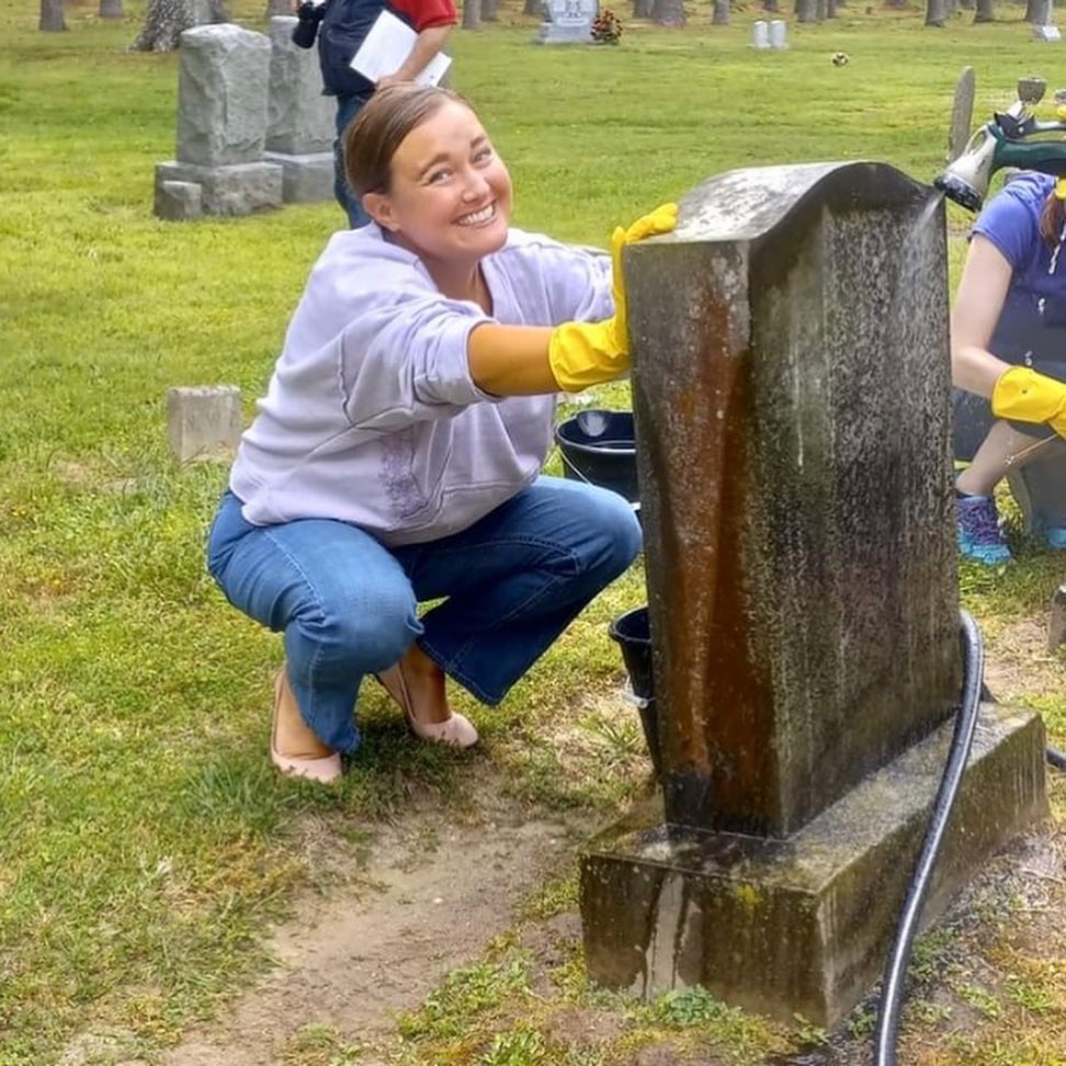 women cleaning headstone st Luke’s church smithfield